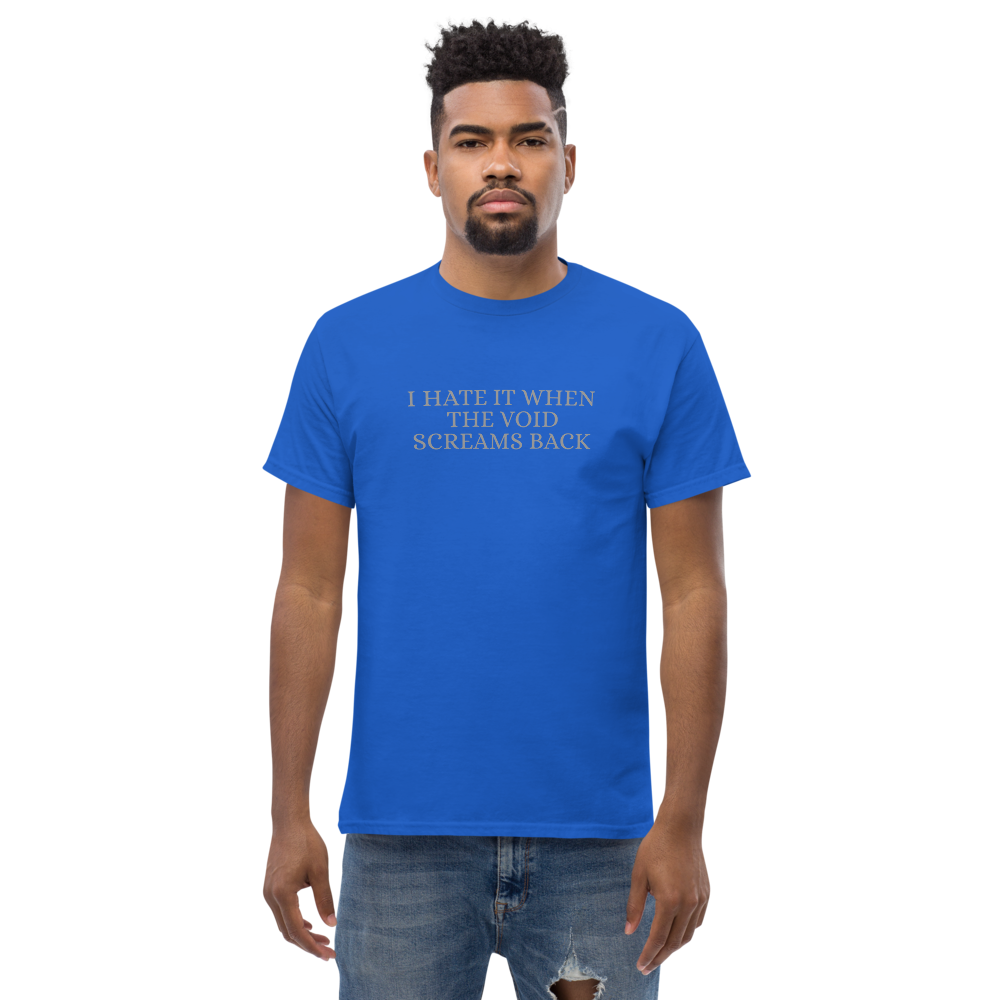 "I hate it when the void screams back" printed on a royal unisex classic tee worn by a male