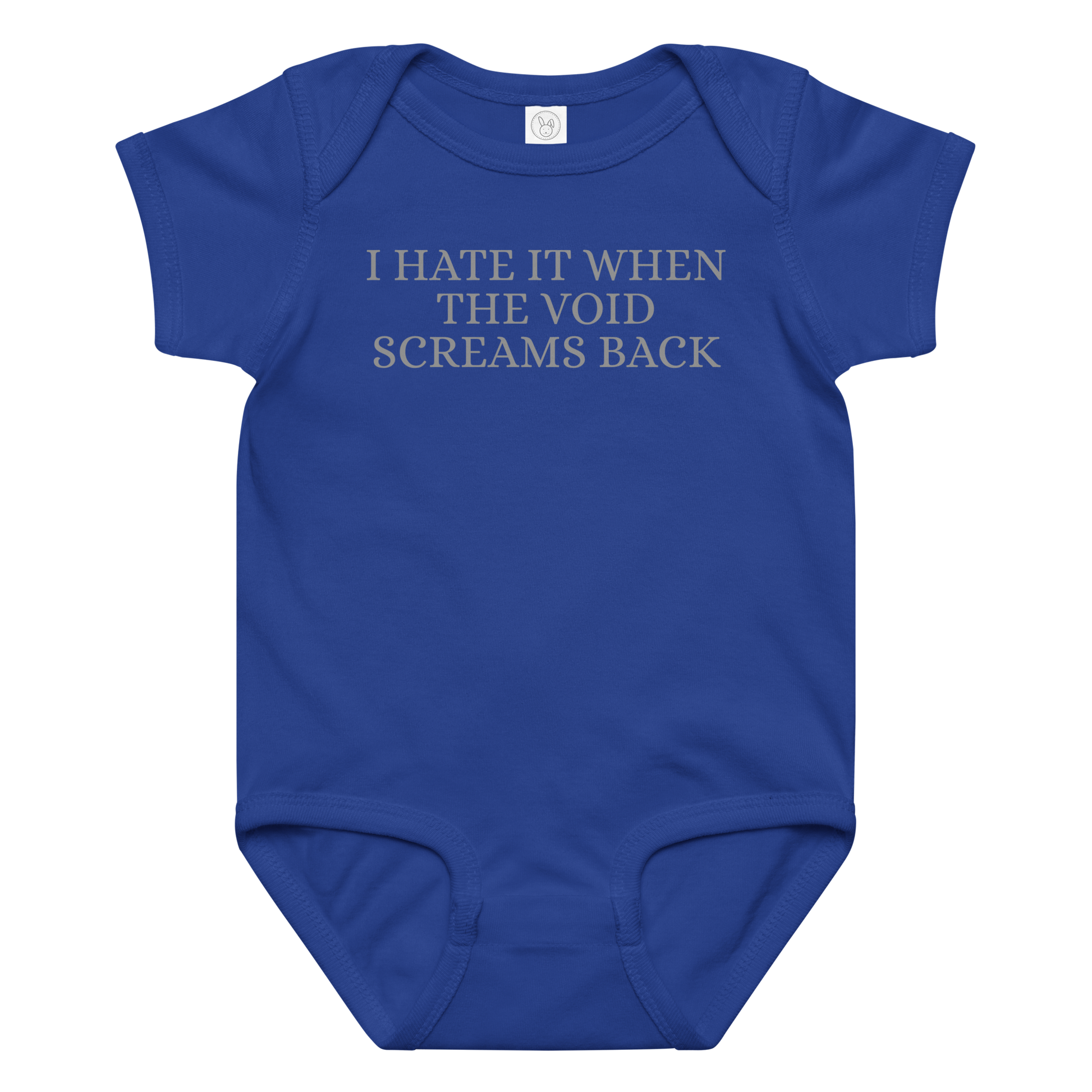 "I hate it when the void screams back" printed on a royal baby jersey bodysuit laying on a flat surface amongst other clothes