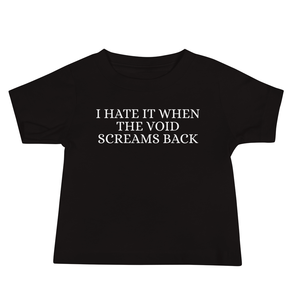 "I hate it when the void screams back" printed on a black baby jersey short sleeve tee laying on a flat surface