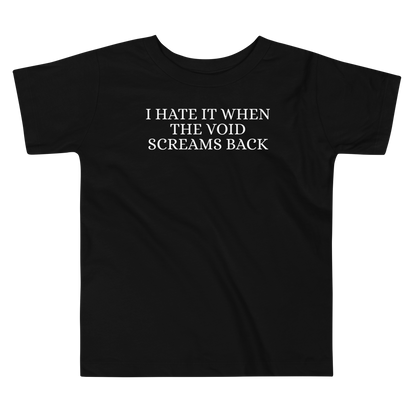 "I hate it when the void screams back" printed on a black toddler short sleeve tee laying on a flat surface