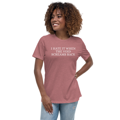 "I hate it when the void screams back" printed on a heather mauve women's relaxed t-shirt worn by a female