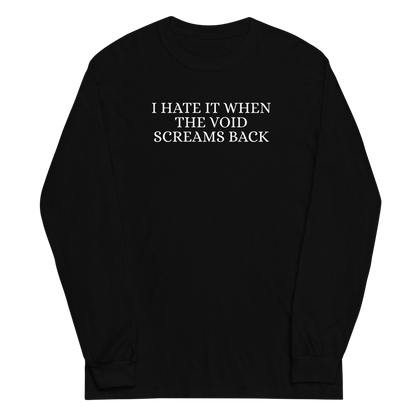 "I hate it when the void screams back" printed on a black men's long sleeve shirt laying on a flat surface
