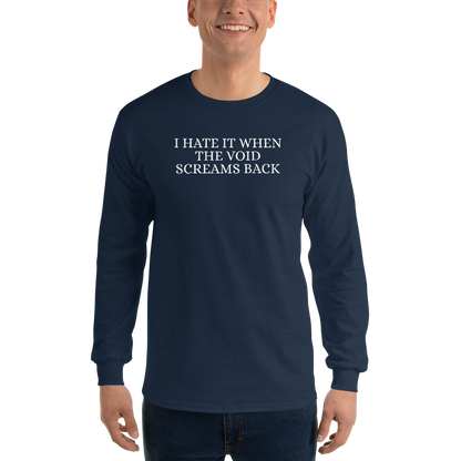 "I hate it when the void screams back" printed on a navy men's long sleeve shirt worn by a male