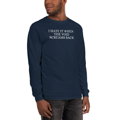 "I hate it when the void screams back" printed on a navy men's long sleeve shirt worn by a male