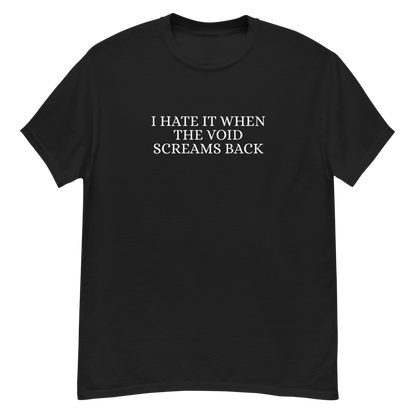 "I hate it when the void screams back" printed on a black unisex classic tee laying on a flat surface