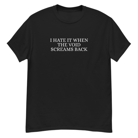 "I hate it when the void screams back" printed on a black unisex classic tee laying on a flat surface