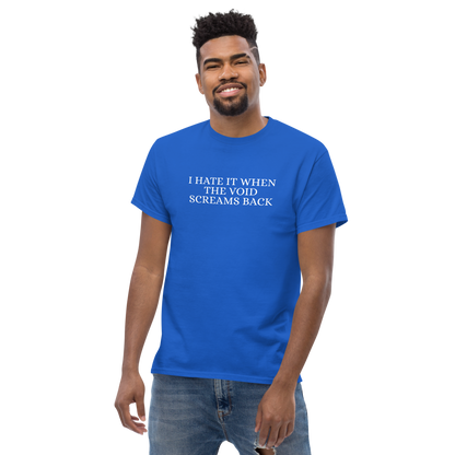 "I hate it when the void screams back" printed on a royal unisex classic tee worn by a male