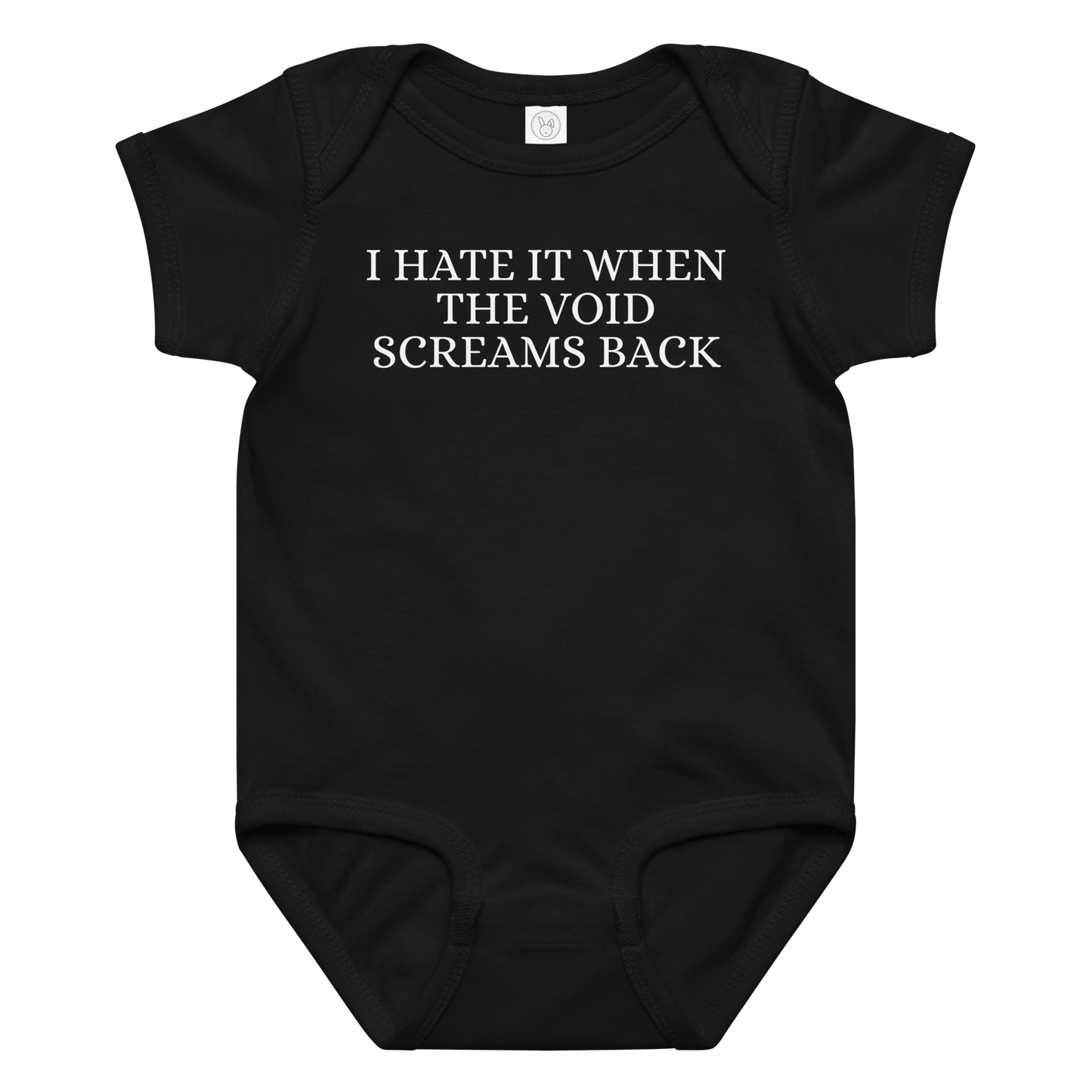 "I hate it when the void screams back" printed on a black baby jersey bodysuit laying on a flat surface amongst other clothes