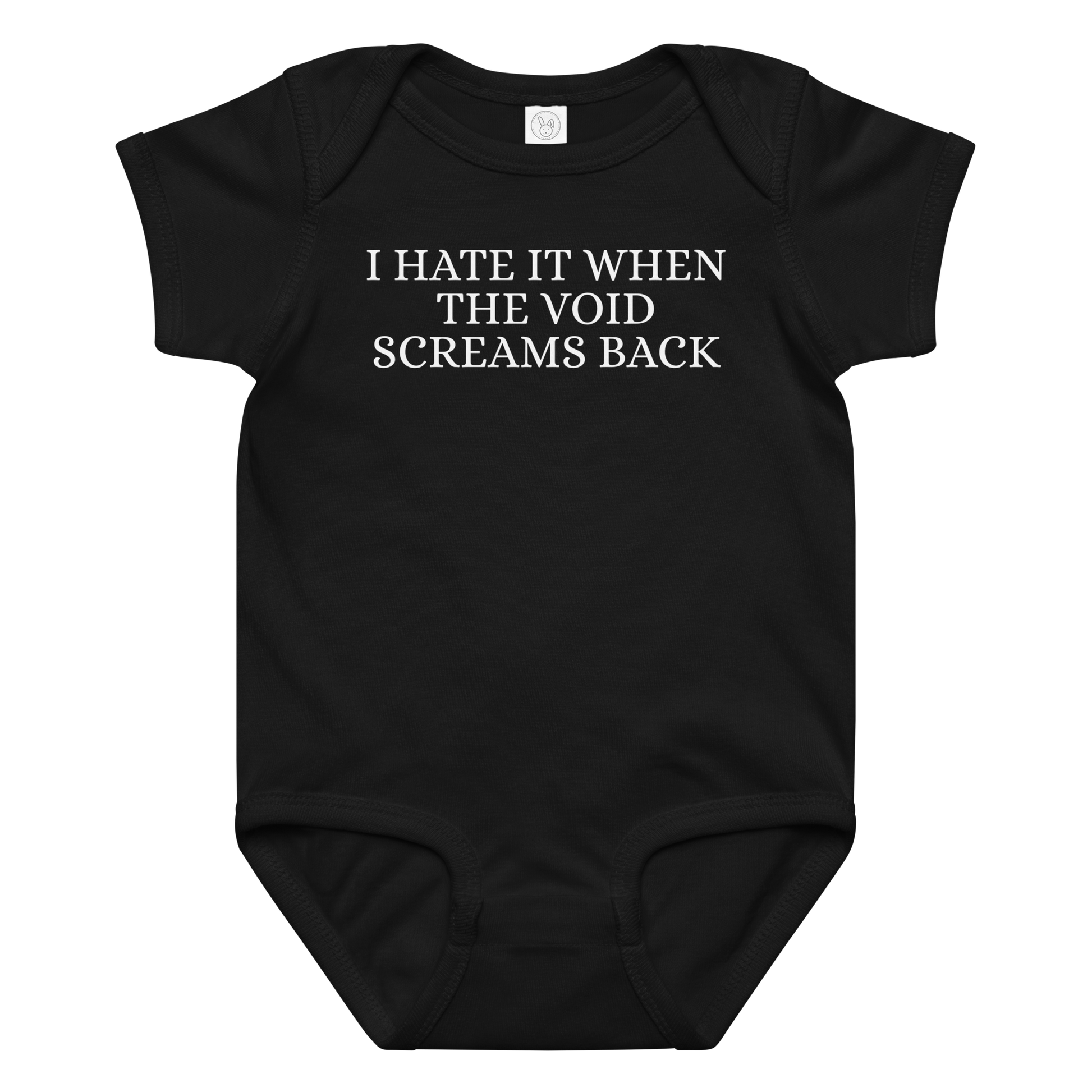 "I hate it when the void screams back" printed on a black baby jersey bodysuit laying on a flat surface amongst other clothes