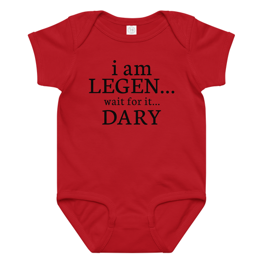 "I Am Legen... Wait For It... Dary" printed on a red baby jersey bodysuit laying on a flat surface amongst other clothes