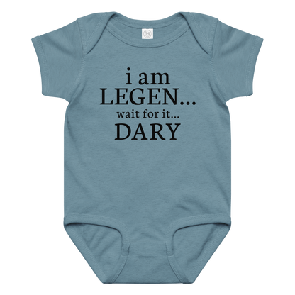 "I Am Legen... Wait For It... Dary" printed on a vintage indigo baby jersey bodysuit laying on a flat surface amongst other clothes