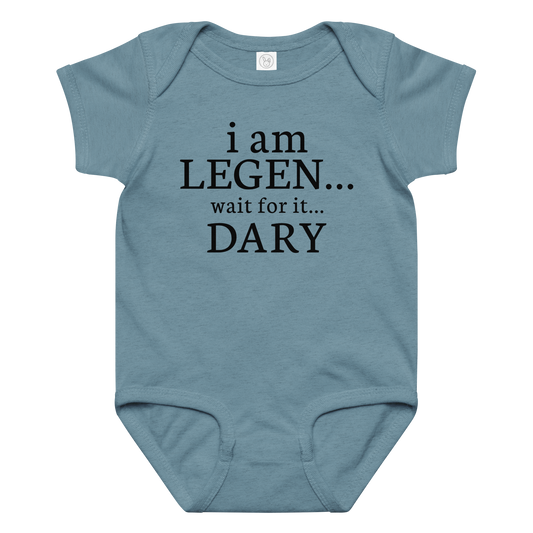 "I Am Legen... Wait For It... Dary" printed on a vintage indigo baby jersey bodysuit laying on a flat surface amongst other clothes