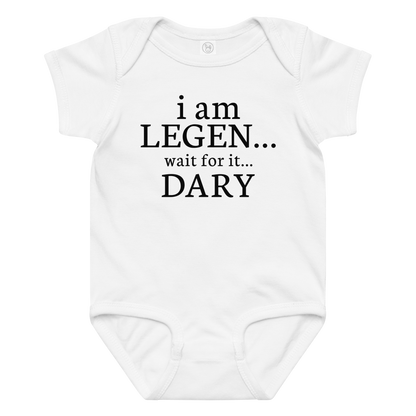 "I Am Legen... Wait For It... Dary" printed on a white baby jersey bodysuit laying on a flat surface amongst other clothes