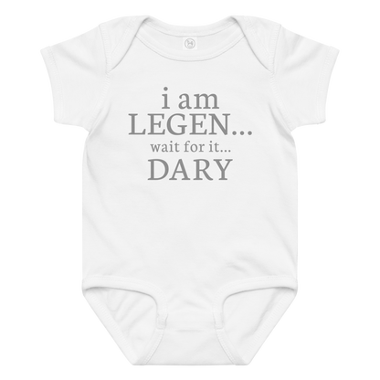 "I Am Legen... Wait For It... Dary" printed on a white baby jersey bodysuit laying on a flat surface amongst other clothes