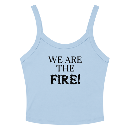 "We are the fire!" printed on a solid baby blue blend women's micro-rib tanktop laying on a flat surface amongst sunglasses and shorts