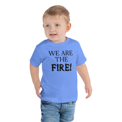 "We are the fire!" printed on a heather columbia blue toddler short sleeve tee worn by a male