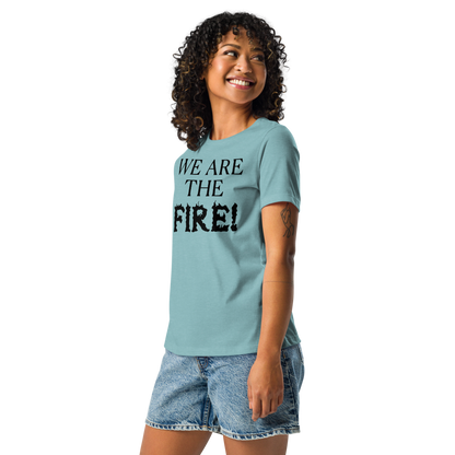 "We are the fire!" printed on a heather blue lagoon women's relaxed t-shirt worn by a female