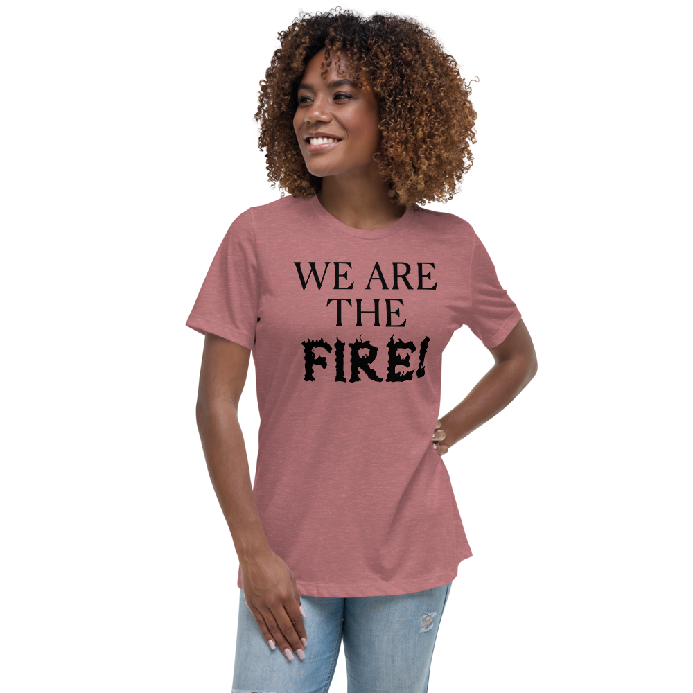 "We are the fire!" printed on a heather mauve women's relaxed t-shirt worn by a female