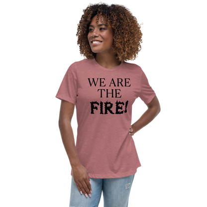 "We are the fire!" printed on a heather mauve women's relaxed t-shirt worn by a female