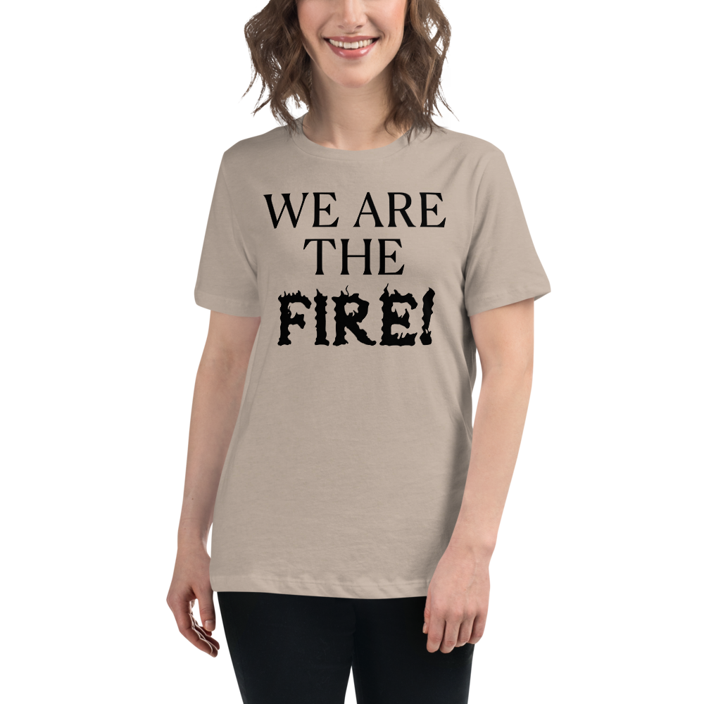 "We are the fire!" printed on a heather stone women's relaxed t-shirt worn by a female