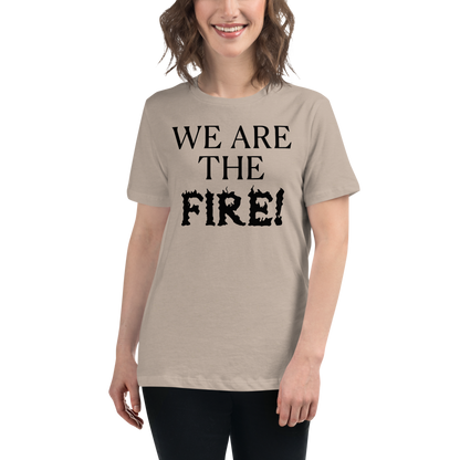 "We are the fire!" printed on a heather stone women's relaxed t-shirt worn by a female