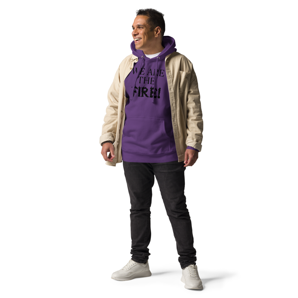 "We are the fire!" printed on a purple unisex hoodie worn by a male with a jacket on top