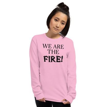 "We are the fire!" printed on a light pink men's long sleeve shirt worn by a female
