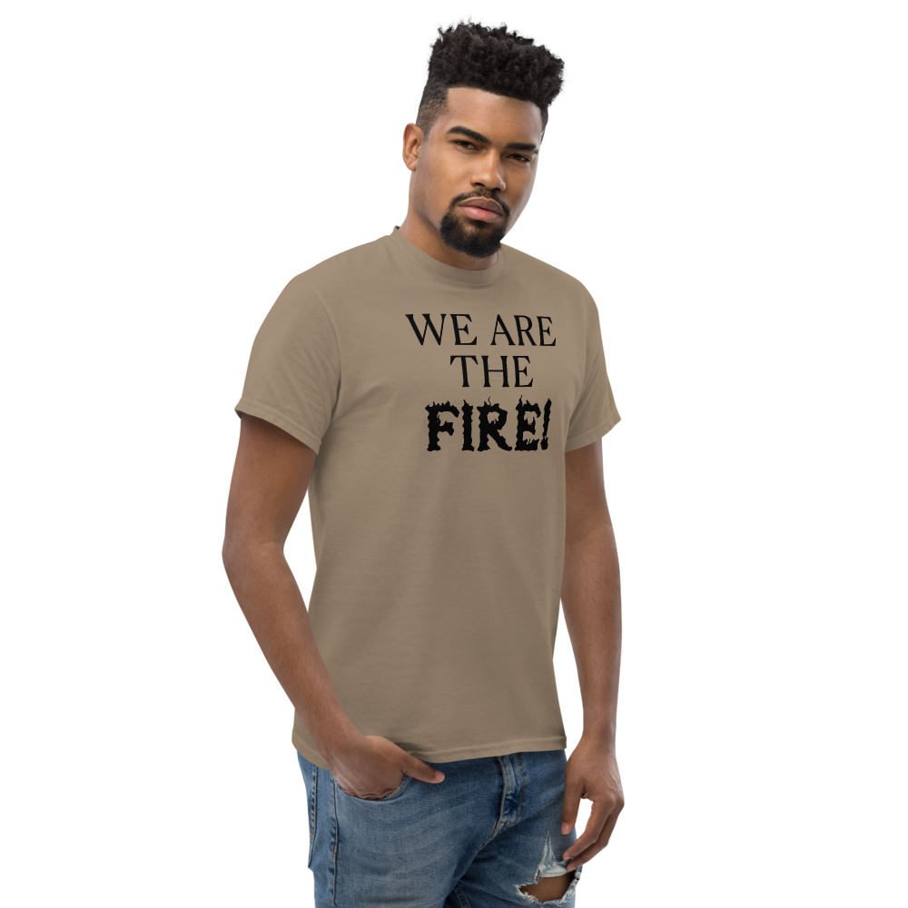 "We are the fire!" printed on a brown savana unisex classic tee worn by a male