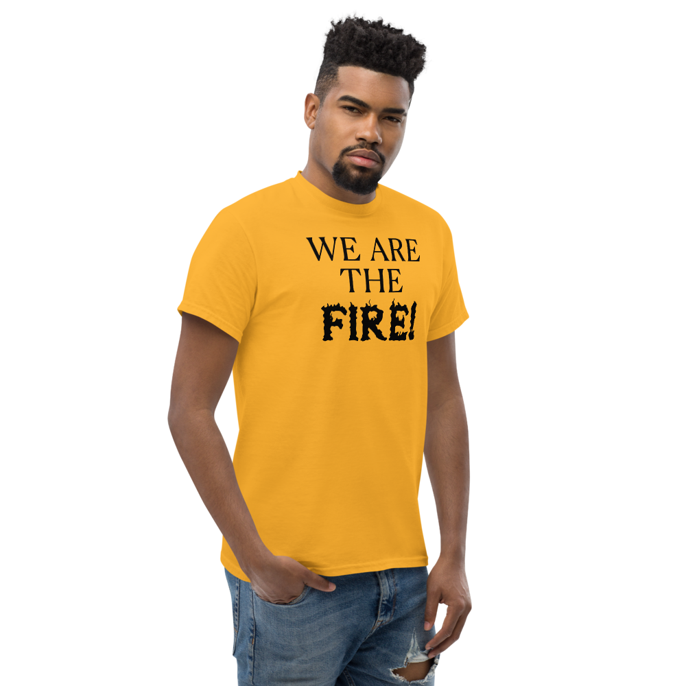 "We are the fire!" printed on a gold unisex classic tee worn by a male