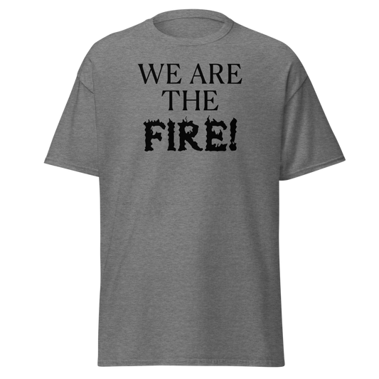 "We are the fire!" printed on a graphite heather unisex classic tee laying on a flat surface