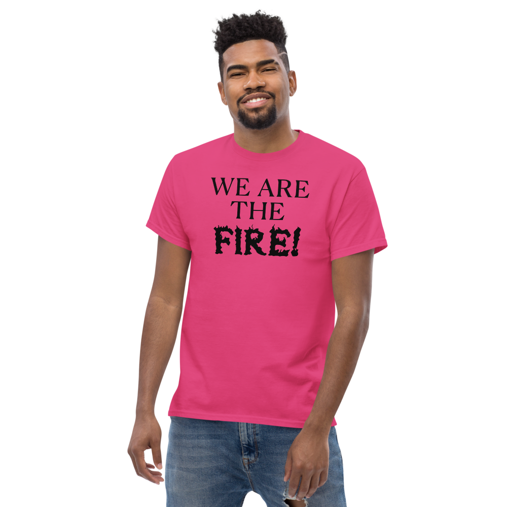 "We are the fire!" printed on a heliconia unisex classic tee worn by a male
