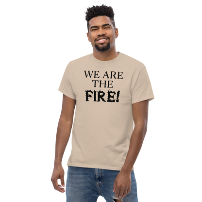 "We are the fire!" printed on a sand unisex classic tee worn by a male