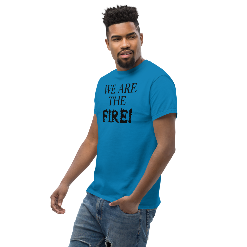 "We are the fire!" printed on a sapphire unisex classic tee worn by a male