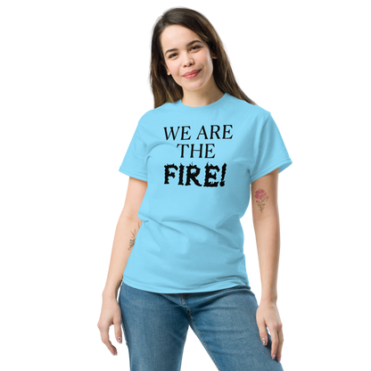 "We are the fire!" printed on a sky unisex classic tee worn by a female