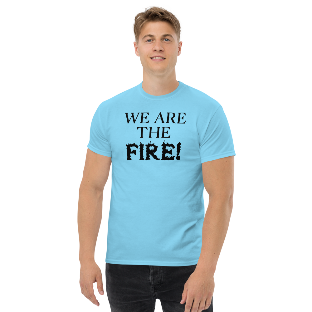 "We are the fire!" printed on a sky unisex classic tee worn by a male