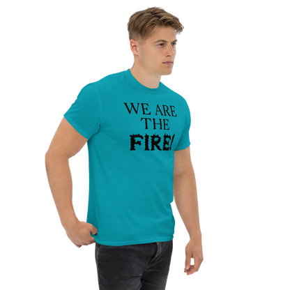 "We are the fire!" printed on a tropical blue unisex classic tee worn by a male