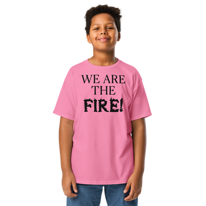 "We are the fire!" printed on a azalea youth classic tee worn by a male