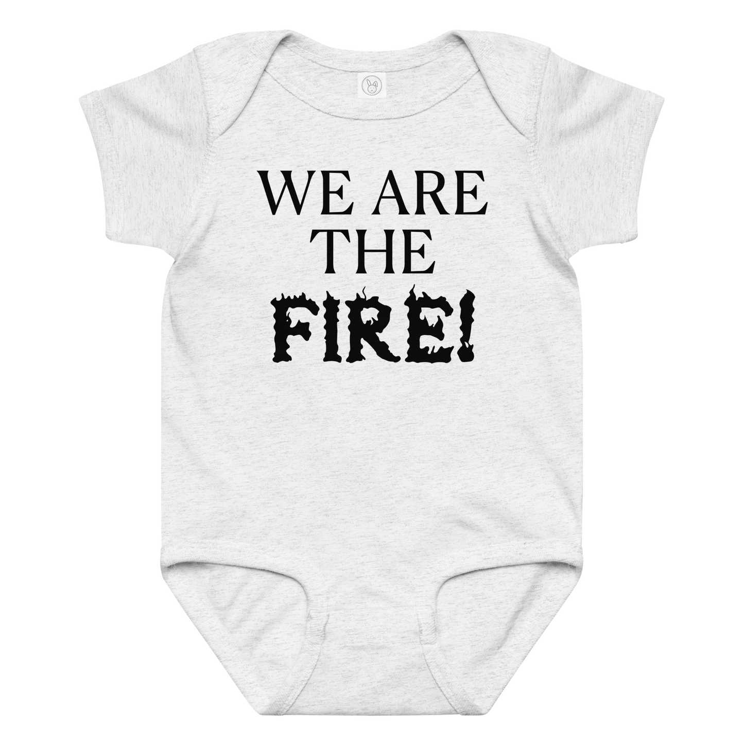"We are the fire!" printed on a ash baby jersey bodysuit laying on a flat surface amongst other clothes