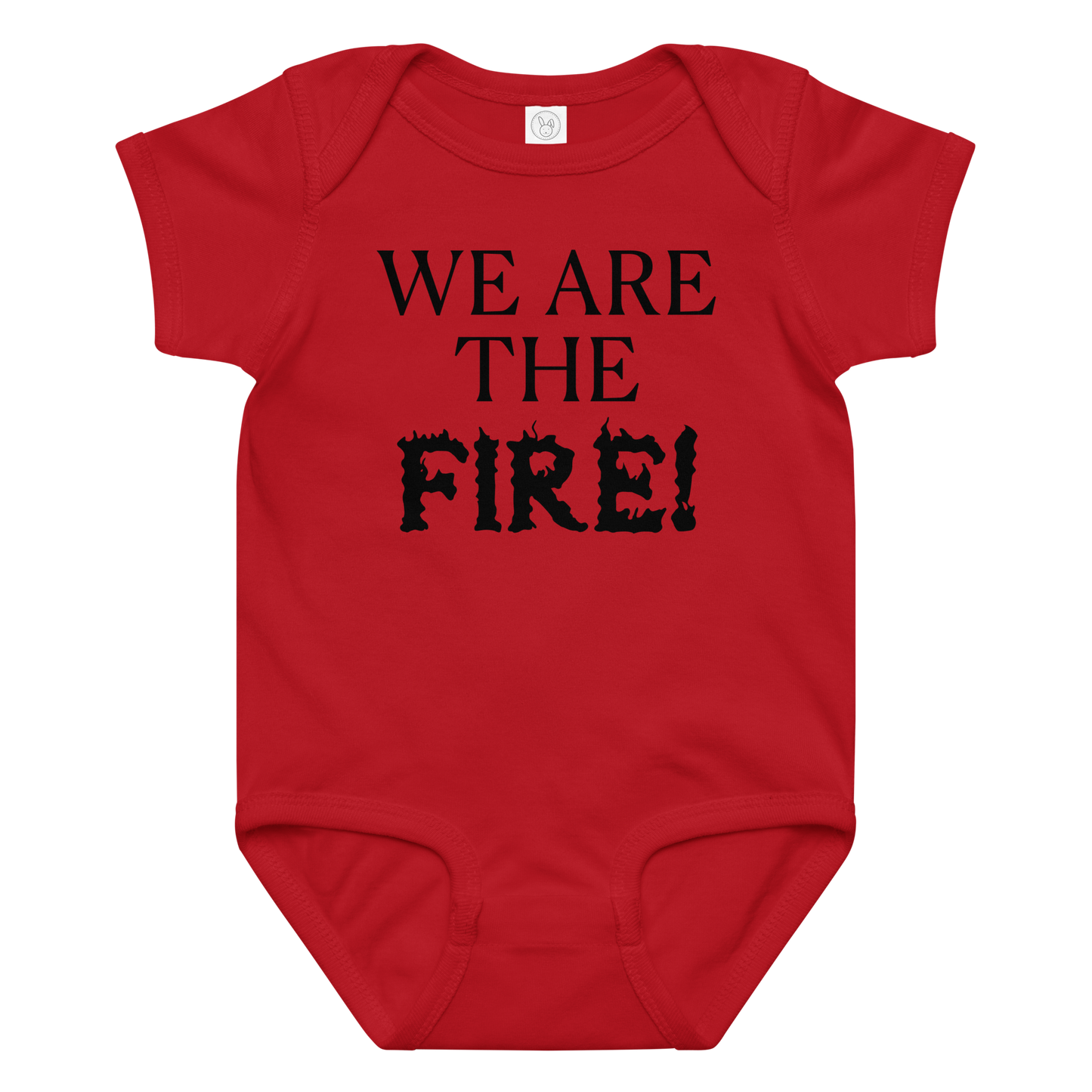 "We are the fire!" printed on a red baby jersey bodysuit laying on a flat surface amongst other clothes