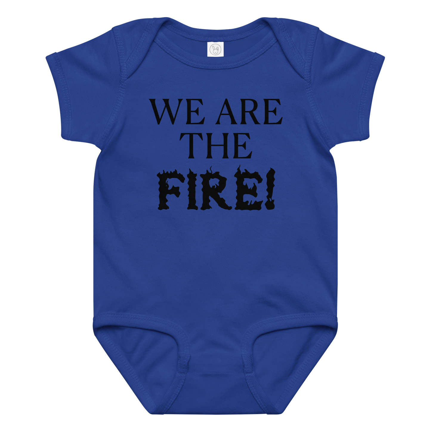 "We are the fire!" printed on a royal baby jersey bodysuit laying on a flat surface amongst other clothes