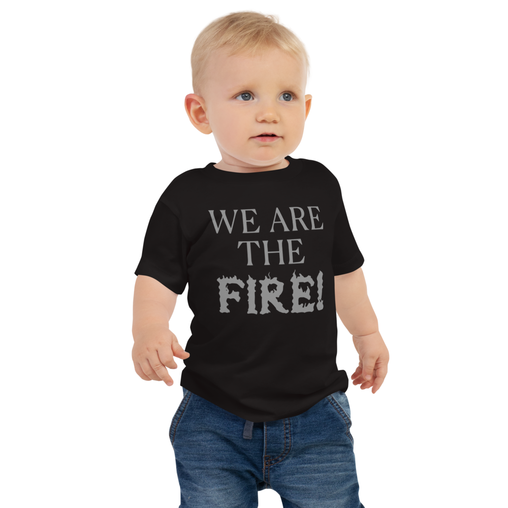 "We are the fire!" printed on a black baby jersey short sleeve tee worn by a male