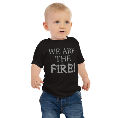 "We are the fire!" printed on a black baby jersey short sleeve tee worn by a male