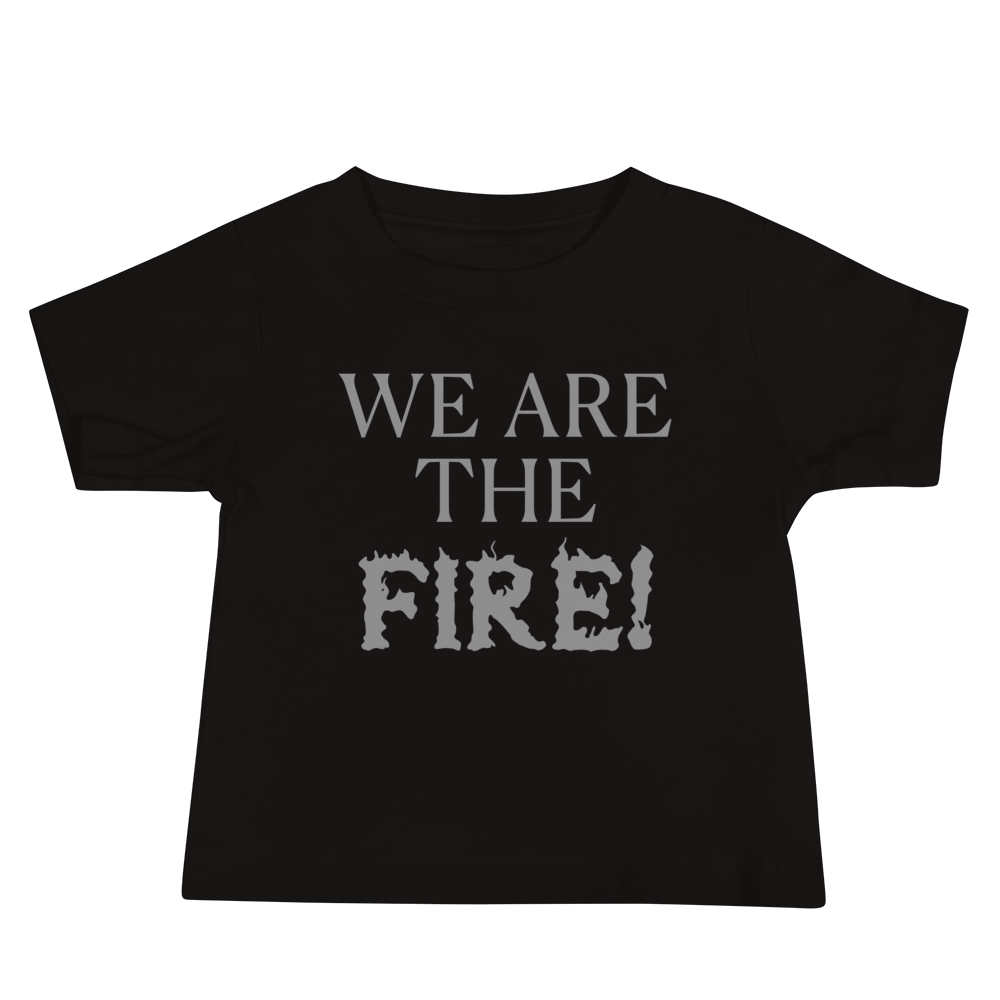 "We are the fire!" printed on a black baby jersey short sleeve tee laying on a flat surface