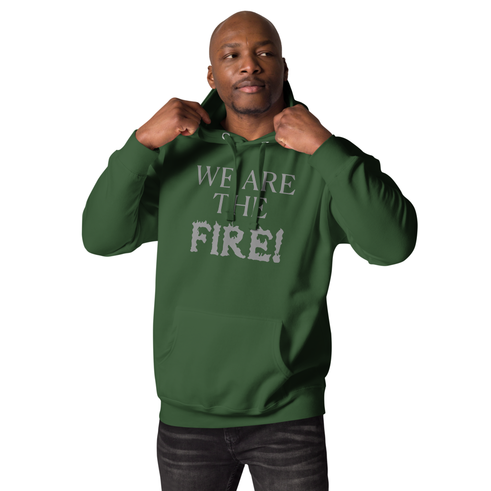"We are the fire!" printed on a forest green unisex hoodie worn by a male