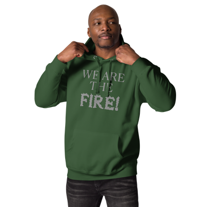 "We are the fire!" printed on a forest green unisex hoodie worn by a male