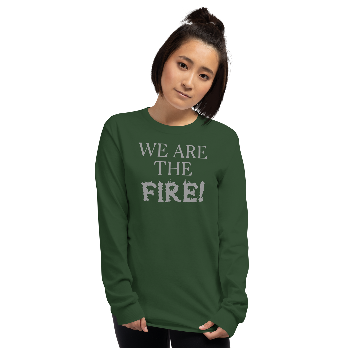"We are the fire!" printed on a forest green men's long sleeve shirt worn by a female