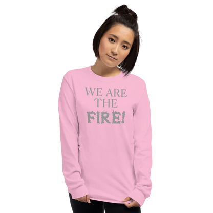 "We are the fire!" printed on a light pink men's long sleeve shirt worn by a female