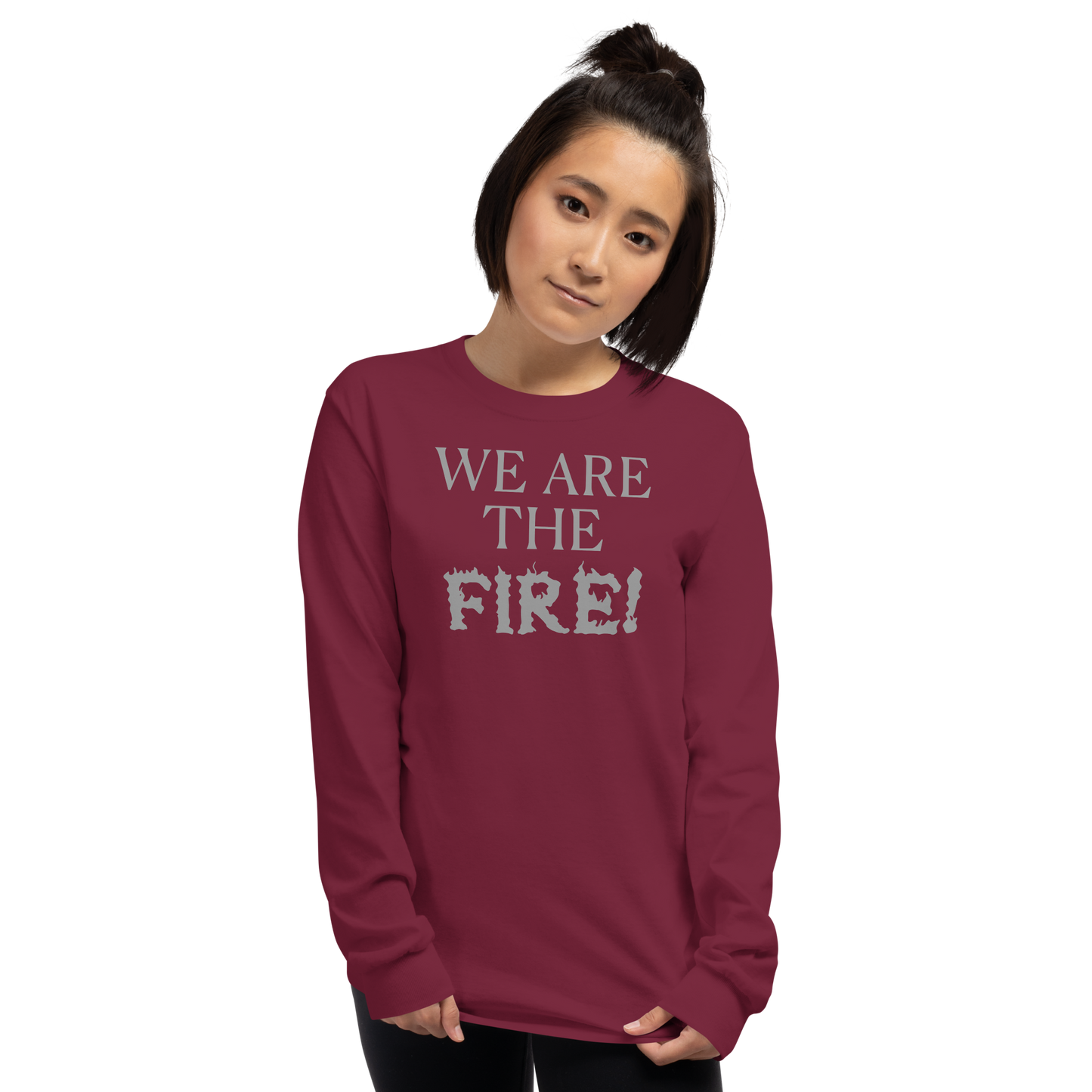 "We are the fire!" printed on a maroon men's long sleeve shirt worn by a female