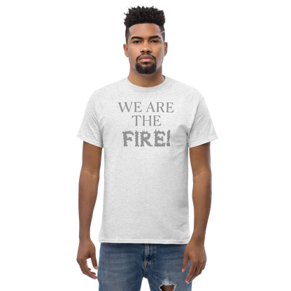 "We are the fire!" printed on a ash unisex classic tee worn by a male