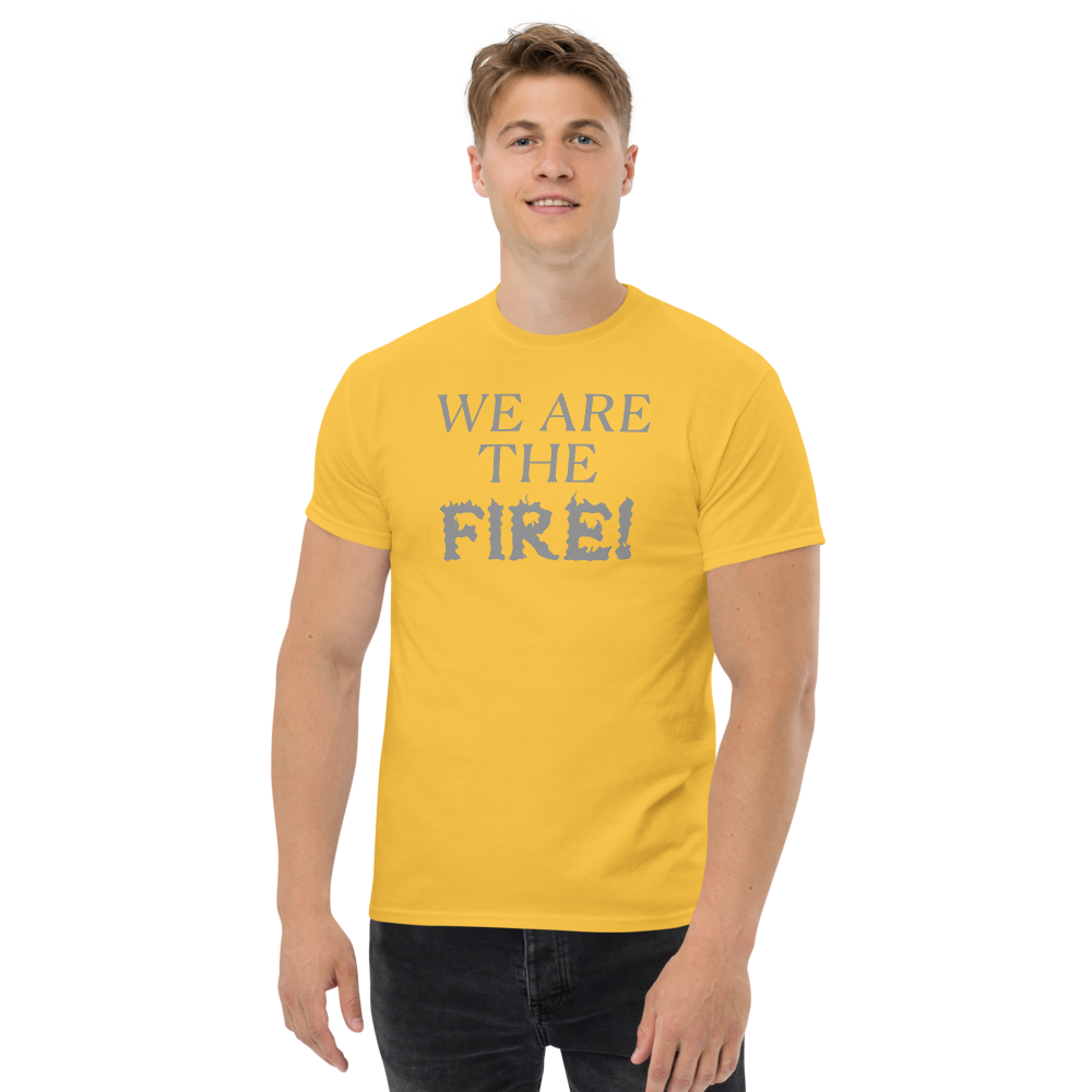 "We are the fire!" printed on a daisy unisex classic tee worn by a male